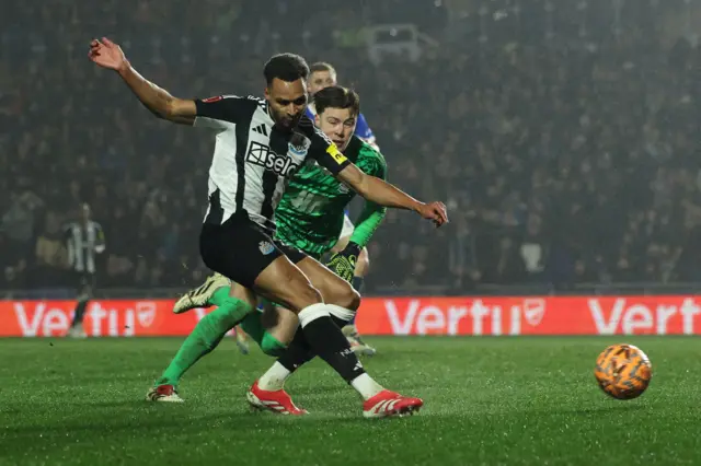 Jacob Murphy passes Birmingham City's Northern Irish goalkeeper Bailey Peacock-Farrell but fails to score