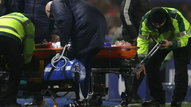 Birmingham City's Scottish midfielder Marc Leonard is stretchered off of the pitch