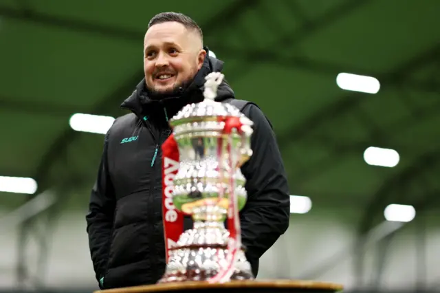 Wolves boss Daniel McNamara with the Women's FA Cup trophy