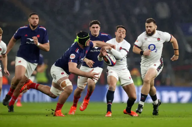 England's Alex Mitchell getting tackled