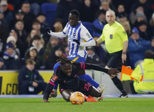 Chelsea's Trevoh Chalobah in action with Brighton & Hove Albion's Yankuba Minteh