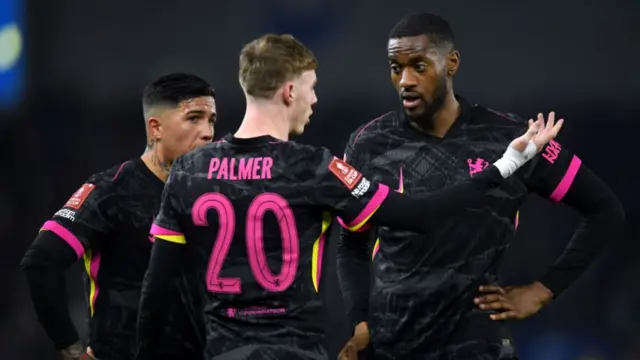 Cole Palmer of Chelsea talks to teammate Tosin Adarabioyo