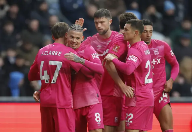 Ipswich Town's Jack Clarke celebrates scoring their third goal with Kalvin Phillips and teammates