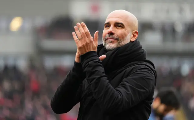 Manchester City manager Pep Guardiola applauds the fans after the game