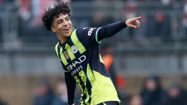 Manchester City's Rico Lewis celebrates their first goal