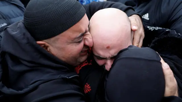 A freed Palestinian prisoner being hugged after being released from an Israeli jail as part of a hostages-prisoners swap