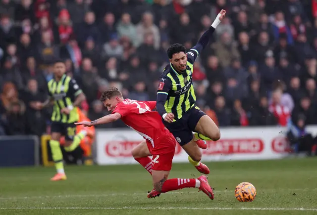 Leyton Orient's Ethan Galbraith in action with Manchester City's Omar Marmoush