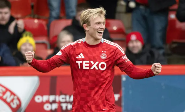 Alexander Jensen beams after scoring his first Dons goal