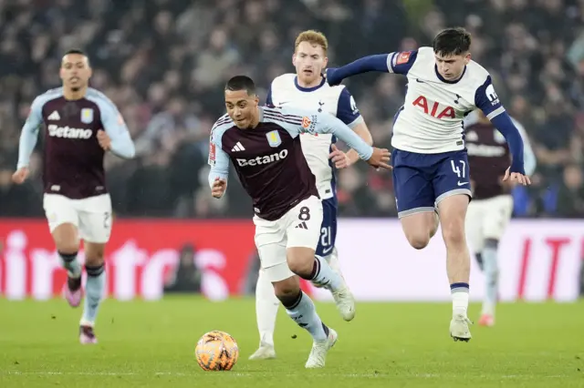 Aston Villa's Youri Tielemans gets away from Tottenham Hotspur's Mikey Moore