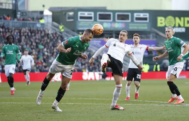 Plymouth Argyle's Nikola Katic in action with Liverpool's Darwin Nunez