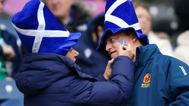 Scotland fan gets face painted