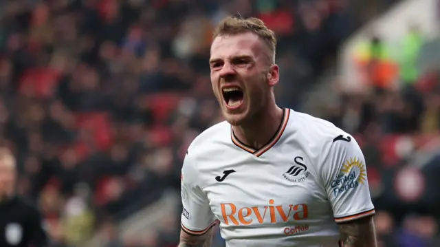 Josh Tymon celebrates