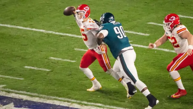 Patrick Mahomes tries to avoid a sack