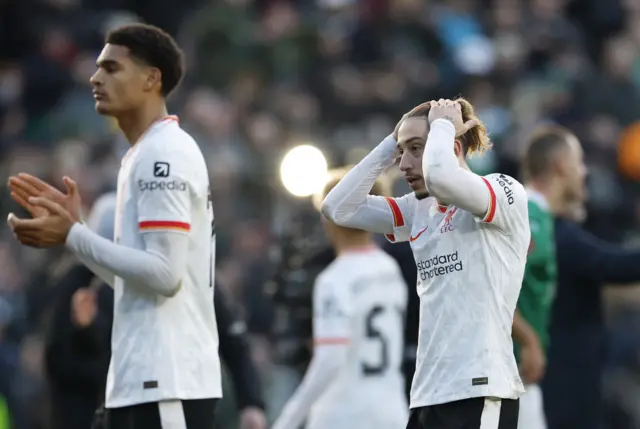 Liverpool's Kostas Tsimikas looks dejected after the match