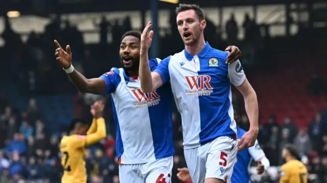 Blackburn Rovers' Scottish defender Dominic Hyam and Blackburn Rovers' Nigerian striker Emmanuel Dennis react after Hyam's goal was ruled out