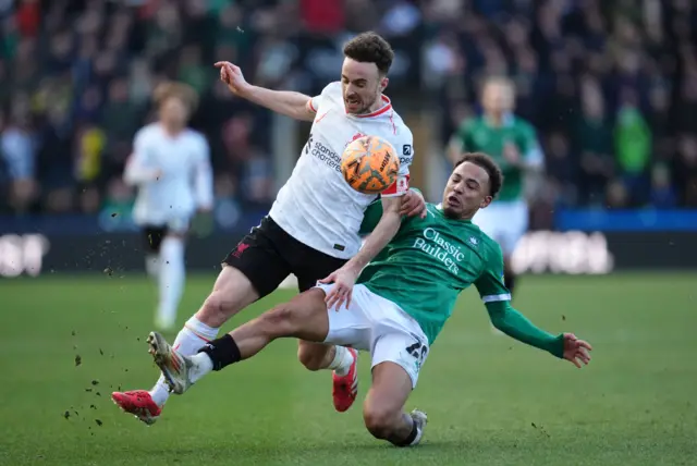 Liverpool's Diogo Jota and Plymouth Argyle's Matthew Sorinola battle for the ball