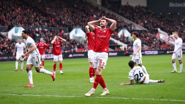 Luke McNally of Bristol reacts after a missed chance