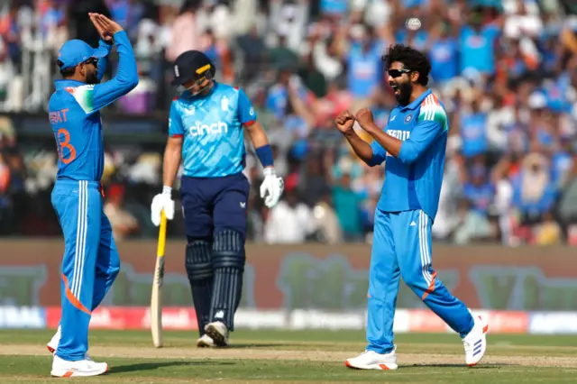 Ravindra Jadeja and Virat Kohli of India celebrate after taking the wicket of Ben Duckett