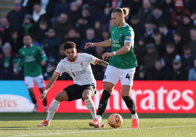 Liverpool's Luis Diaz in action with Plymouth Argyle's Maksym Talovierov