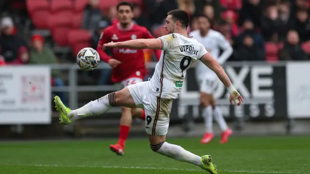 Zan Vipotnik of Swansea City tries to get a shot at goal