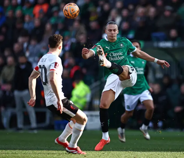 Maksym Talovyerov clears from Liverpool's Portuguese striker Diogo Jota