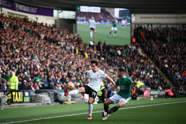 Plymouth's Spanish defender Julio Pleguezuelo vies with Liverpool's Italian striker Federico Chiesa