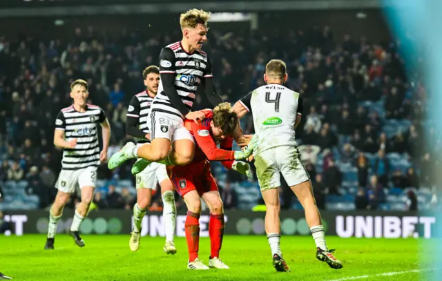 Queen's Park players rush to congratulate Calum Ferrie