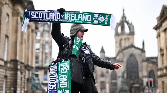 Scarf seller in Edinburgh before Six Nations match between Scotland and Ireland