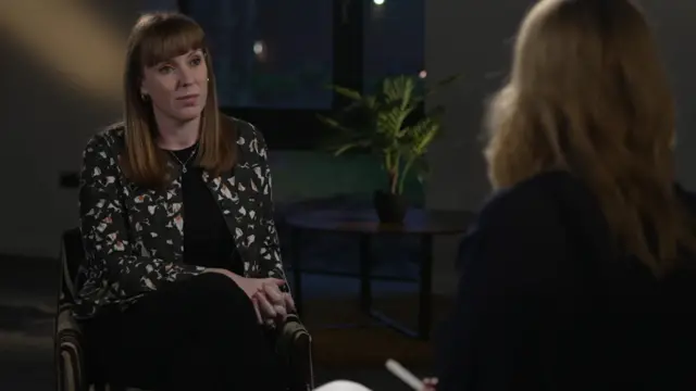 Angela Rayner sits facing Laura Kuenssberg. You can see the back of Kuenssberg's head and her blonde hair.