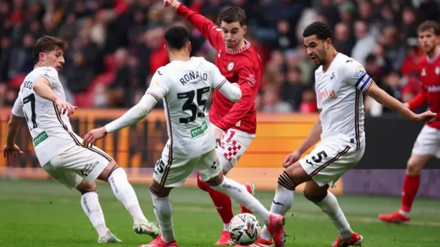 Anis Mehmeti of Bristol battles for the ball with Goncalo Franco, Ronald and Ben Cabango of Swansea