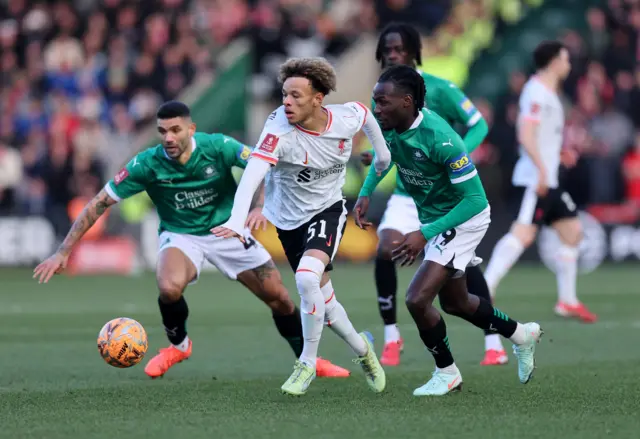 Liverpool's Trent Doherty in action with Plymouth Argyle's Malachi Boateng