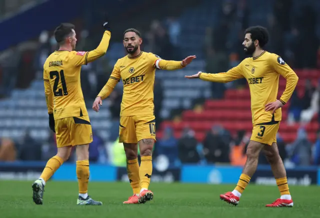 Wolverhampton Wanderers' Matheus Cunha, Wolverhampton Wanderers' Pablo Sarabia and Wolverhampton Wanderers' Rayan Ait-Nouri celebrate after the match