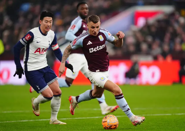 Aston Villa's Lucas Digne and Tottenham Hotspur's Son Heung-Min battle for the ball