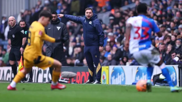 John Eustace, head coach of Blackburn Rovers, encourages his players