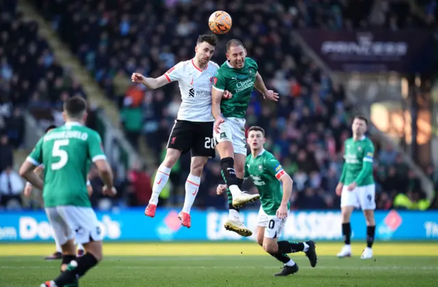 Liverpool's Diogo Jota and Plymouth Argyle's Nikola Katic battle for the ball