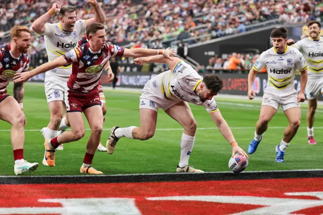 Toby King touches down for a disallowed try for Warrington