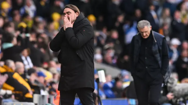 Daniel Farke (left) holds his hands over his mouth after a Leeds chance on goal