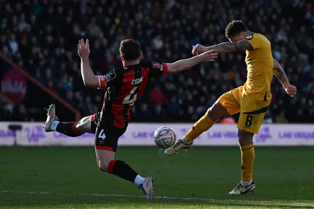 Joao Gomes (R) vies with Bournemouth's English midfielder Lewis Cook