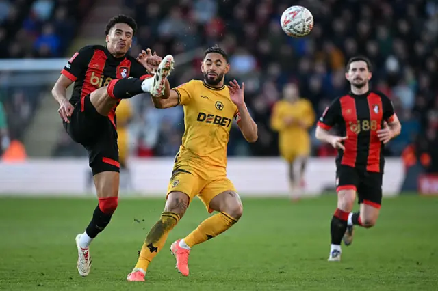 James Hill (L) vies with Wolverhampton Wanderers' Brazilian striker Matheus Cunha