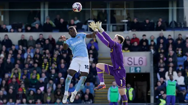 Ephron Mason-Clark jumps to head the ball in for Coventry