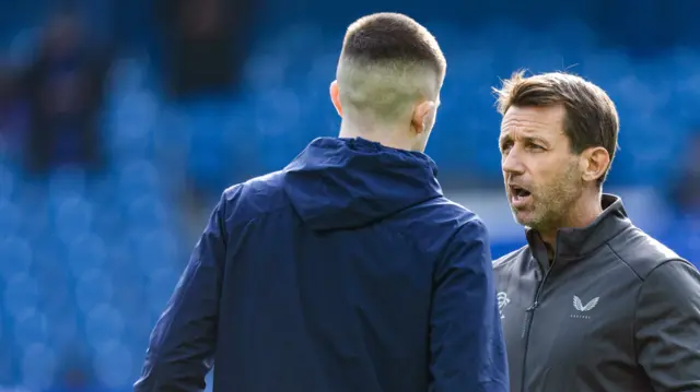 Rangers interim coach Neil McCann (R) with Bailey Rice before a William Hill Premiership match between Rangers and Motherwell at Ibrox Stadium,