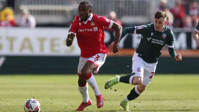 Sebastian Revan of Wrexham and Szabolcs Schön of Bolton Wanderers