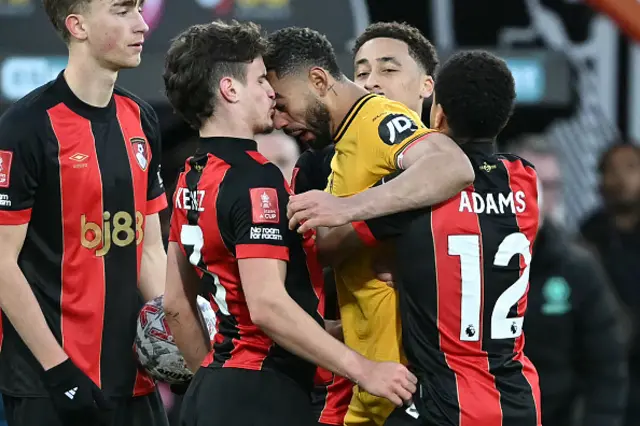 Matheus Cunha (C) clashes with Bournemouth's Hungarian defender Milos Kerkez