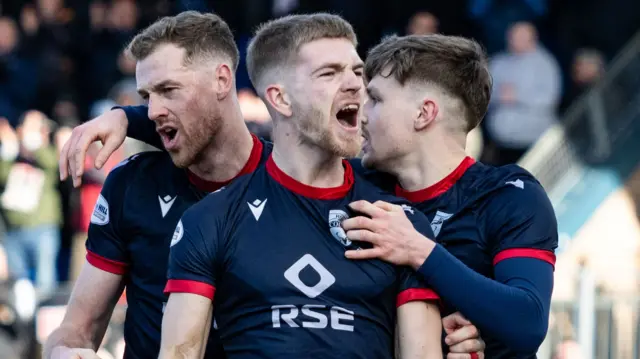 Ross County's Kieran Phillips (centre) celebrates after scoring to make it 1-0 during a William Hill Premiership match between Ross County and Kilmarnock at the Global Energy Stadium