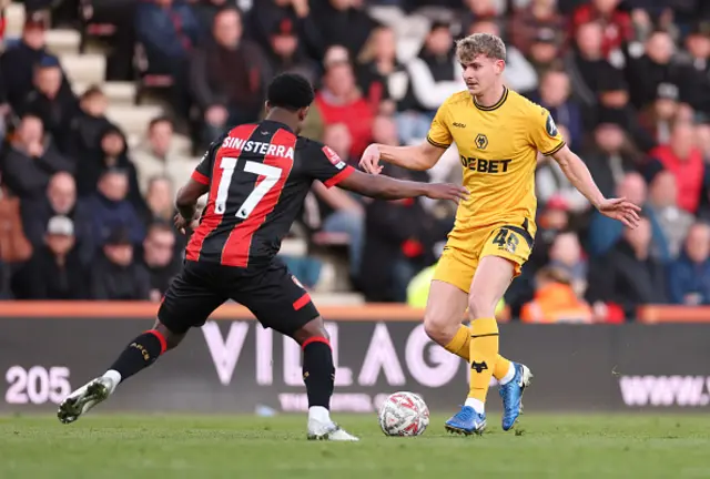 Alfie Pond of Wolverhampton Wanderers is challenged by Luis Sinisterra