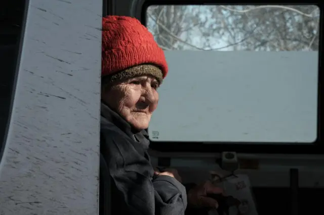 Anna, who is about to turn 80 and has no family, is evacuated by members of the 'East SOS' charity foundation from the frontline city of Kostyantynivka, Donetsk region, eastern Ukraine, 25 February 2025,