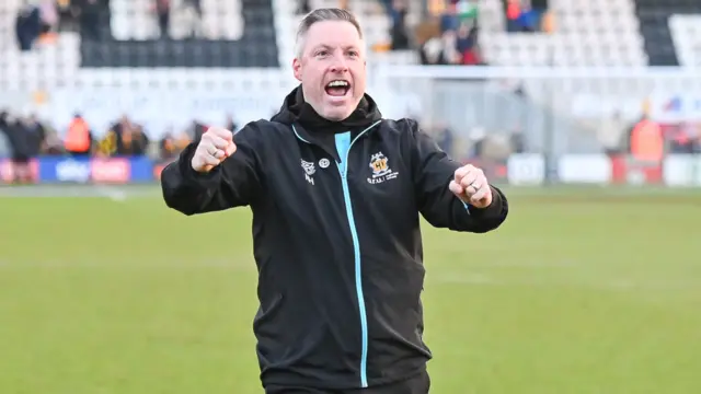 Cambridge boss Neil Harris celebrates the win over Stockport