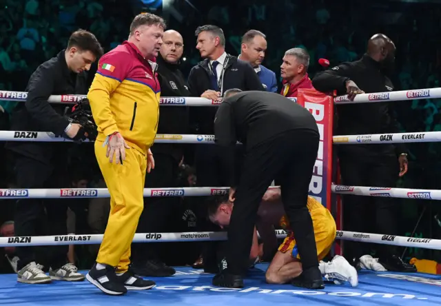 Paddy Donovan is consoled by his team