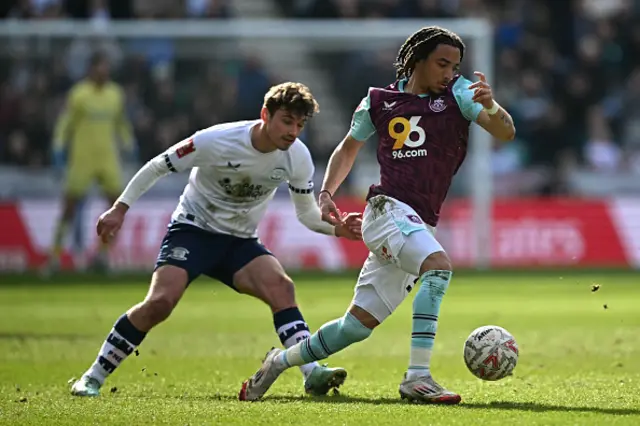 Luca Koleosho runs with the ball