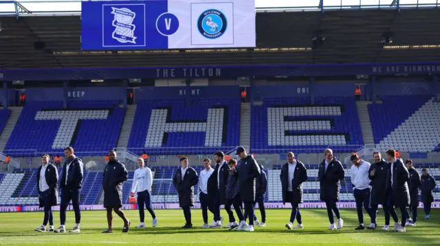 Players walk on the pitch before Birmingham v Wycombe